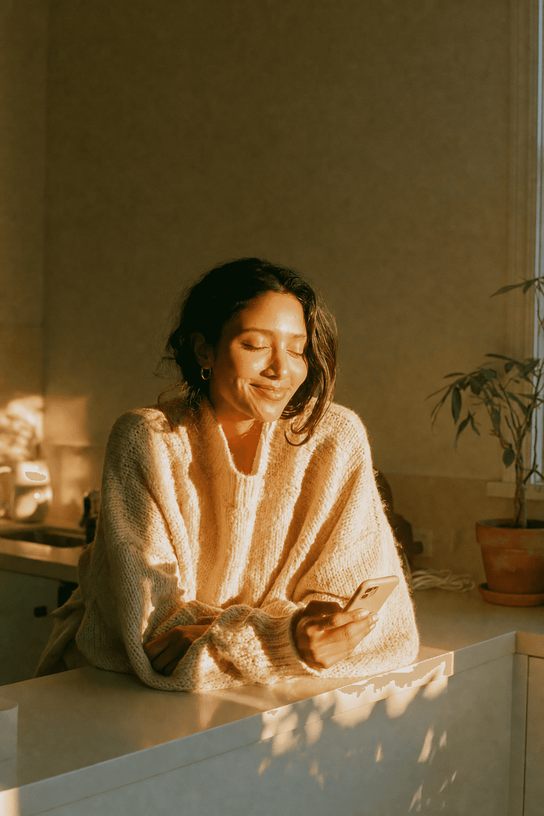 Teledris patient feeling supported by online care from her sunlit kitchen